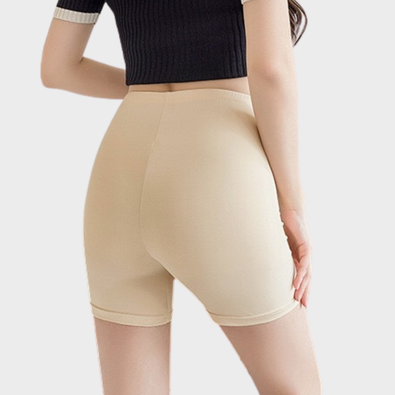 Huidskleurige skort onder jurk