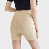 Huidskleurige skort onder jurk