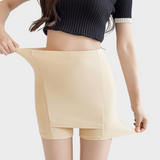 Huidskleurige skort onder jurk